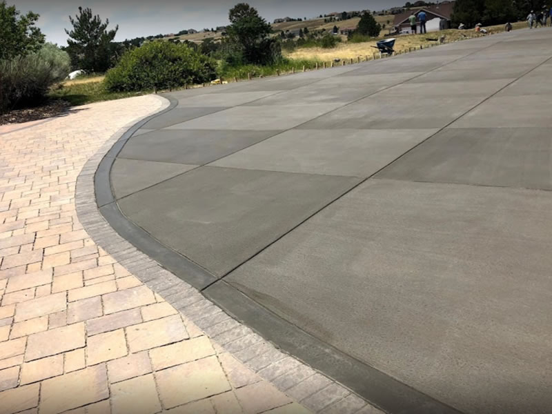 Stamped sidewalk with decorative edge along driveway