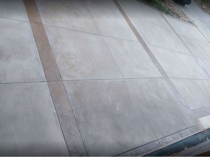 Colored stamped concrete edge driveway