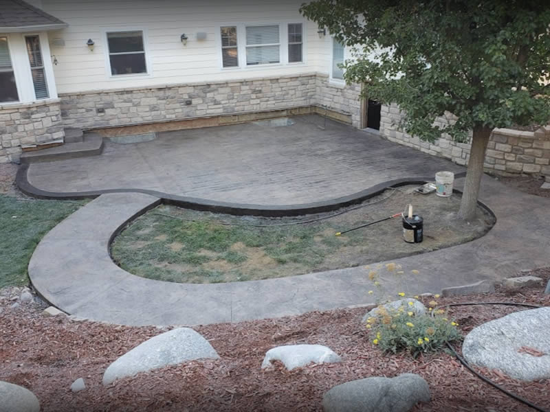 Concrete patio space with planting area