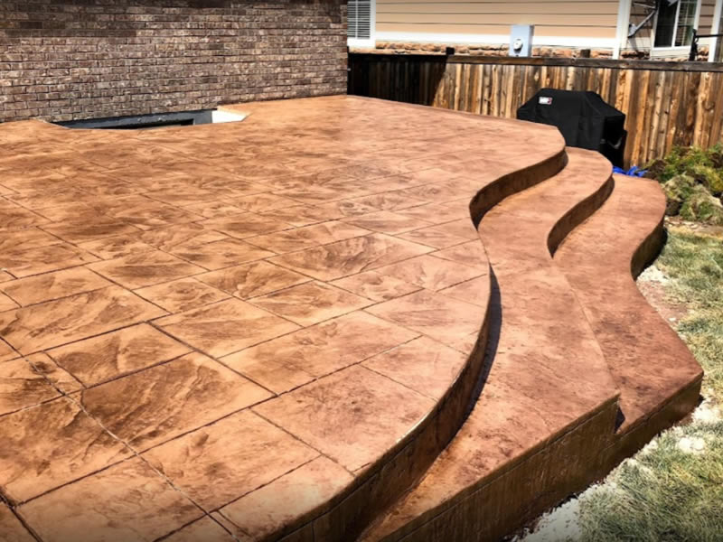 Stamped concrete patio with full length steps